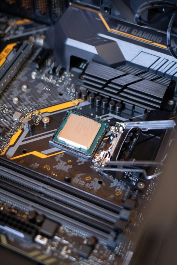 pexels photo 2582935 2582935 Detailed view of a motherboard with an exposed CPU, showcasing technology components.